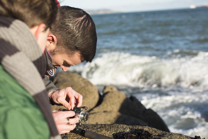 A father and son fishing in the sea