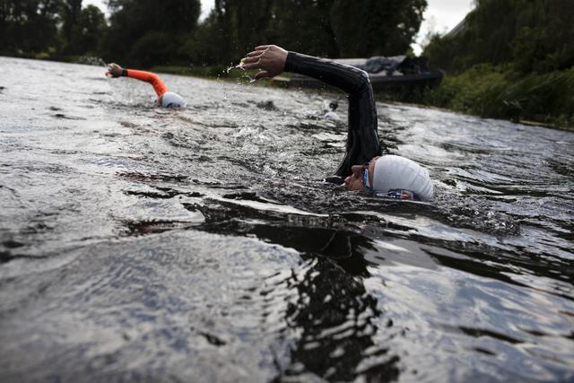 People swimming in a river