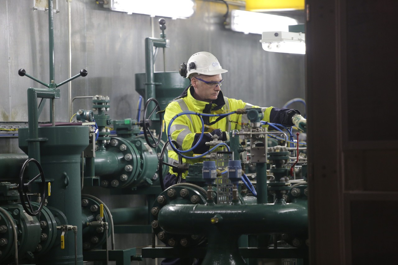 An Uisce Éireann worker using machinery in a water treatment plant