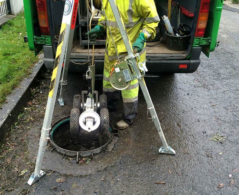 An Uisce Éireann worker surveying a sewer