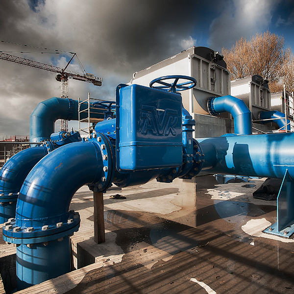 Large blue pipes in a water treatment plant