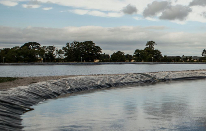 A large body of water being filtered through black fabric