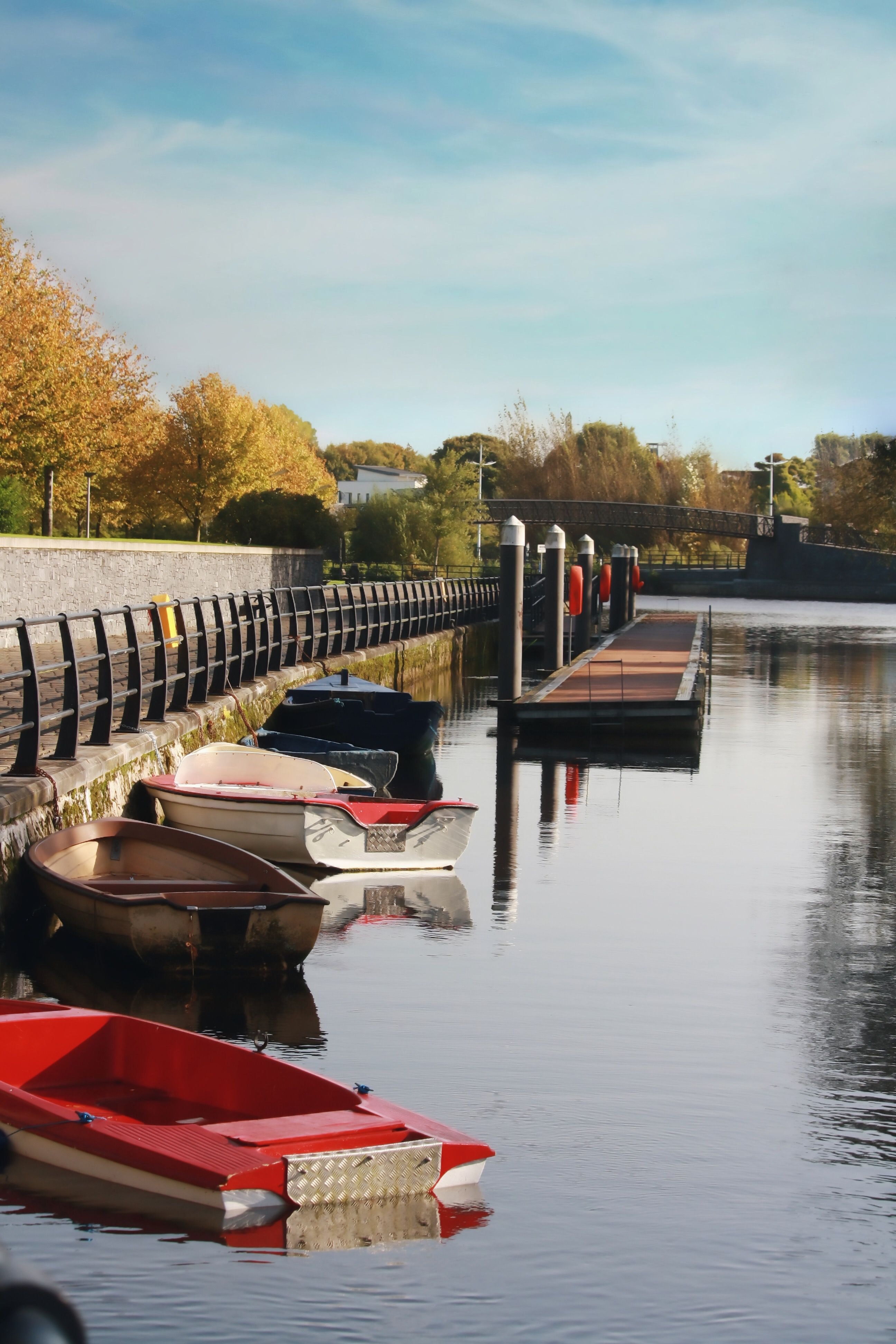 Pier with several small rowboats