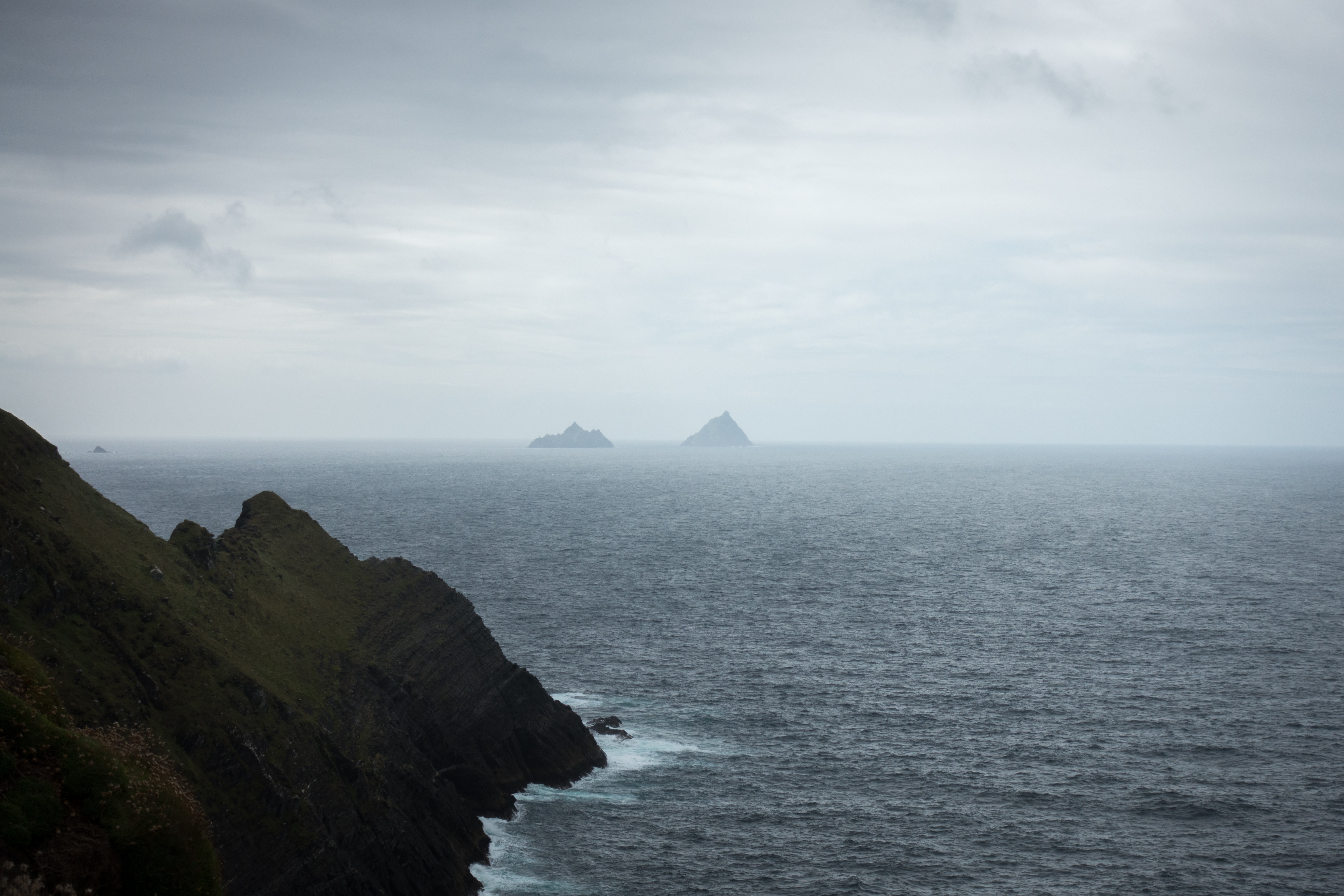 Two small islands in a misty sea