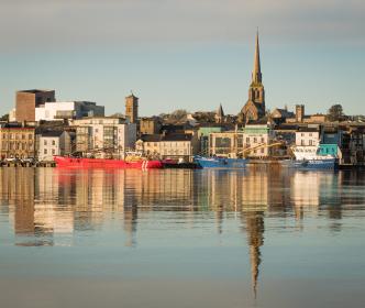 Wexford Town with a large base of water with boats on the water 